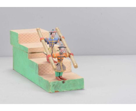 A mid19th century German mercury Chinese acrobat tumbling toy,  papier-mâché headed with black painted hair and long moustach