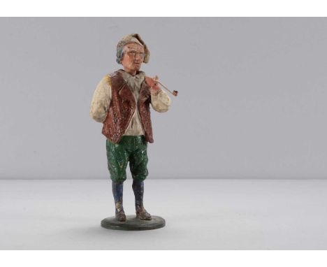A mid 19th century Thüringen smoking man nodder,  papier-mâché with cloth cap, white shirt, open brown waistcoat, smoking a l
