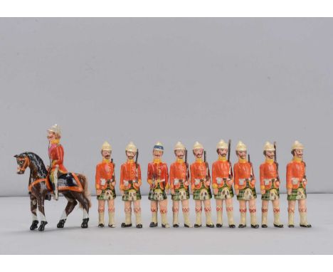 Nine late 19th century composition Highland infantrymen,  with moustaches, white helmets, eight with rifles and one with bugl