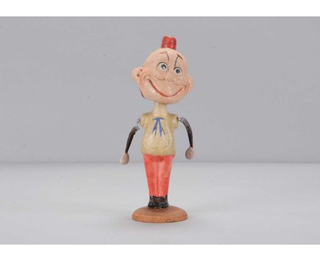 An early 20th century German composition Happy Hooligan bobble-head toy, the comic character with googly eyes, sprung head an