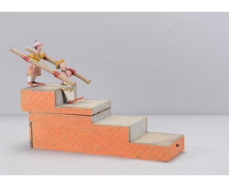 A mid 19th century German mercury Chinese acrobat tumbling toy,  papier-mâché headed with black painted hair, card and wood b