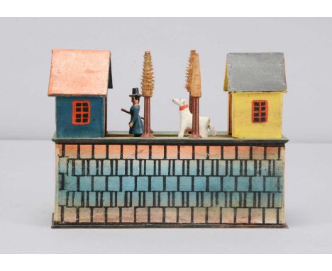 A mid to late 19th century Erzgebirge small belt crank toy, with moving figures of a shepherd, dog and two sheep, moving from