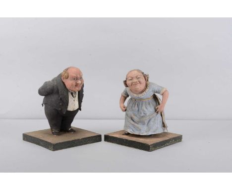 A mid 19th century composition Old Fezziwig and Mrs Fezziwig dancing sweet or trinket containers,  Mr Fezziwig bowing figure 