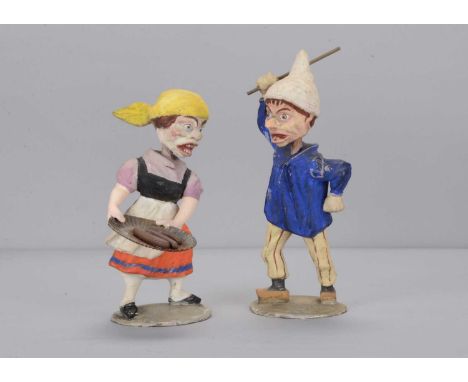 A pair of late 19th century Thüringen ugly arguing   nodders,  the composition man and woman with bulging eyes, open mouth wi