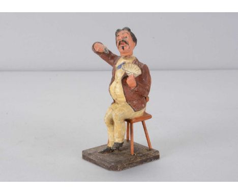 A mid 19th century Thüringen gentleman playing cards nodder,  with dark curly hair, moustache and Imperial, brown jacket, wai