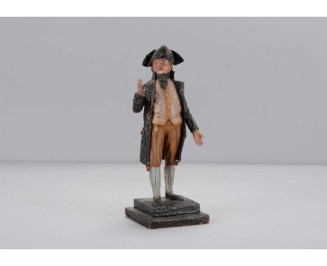 A mid 19th century Rhöner papier-mâché and wood 18th century gentleman,  with tricorne hat, head turned to the right orating,