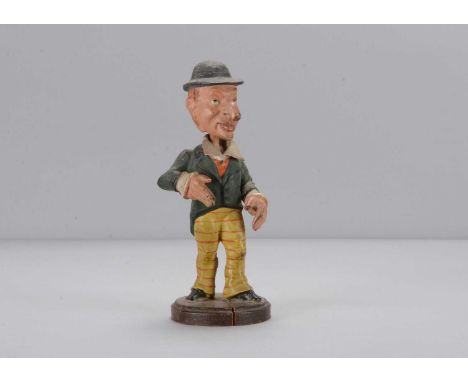 A late 19th century Thüringen large nosed man nodder, composition with narrow face, large hooked nose, reddish brown hair wit