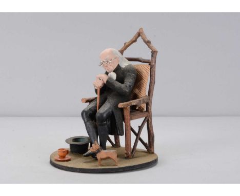 A mid to late 19th century Thüringen Derby elder man, papier-mâché with hands resting on walking stick, added teacup and dog,