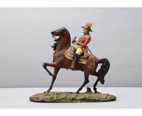 A mid 19th century Thüringen papier-mâché figure of the Duke of Wellington riding Copenhagen, Wellington in red jacket and bi