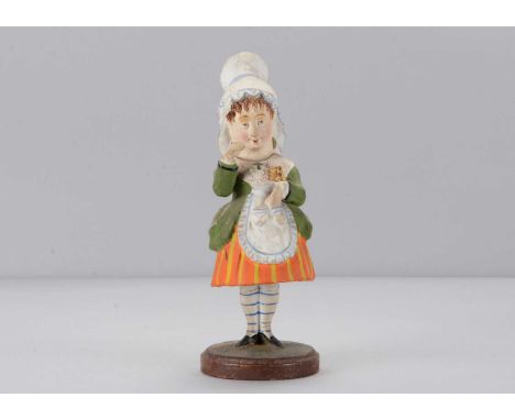 A mid 19th century Thüringen swaying young girl in tall lace cap, with coy expression, blue eyes, tendrils of brown hair onto