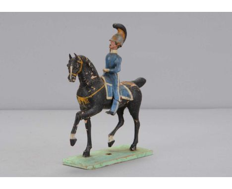 A mid 19th century Thüringen wood and composition European cavalry, possibly Swedish,  with moustache, helmet with large blac