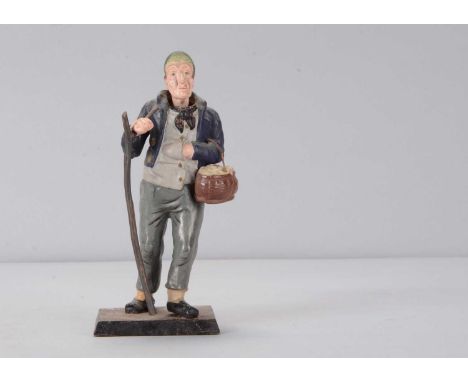 A mid to late 19th century Thüringen man walking with a basket of eggs nodder,  papier-mâché older man with large nose and th