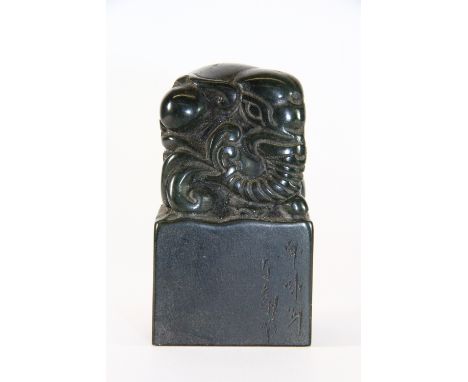 A Chinese dark green soapstone seal mounted with an elephant, H 9cm x 5cm x 5cm