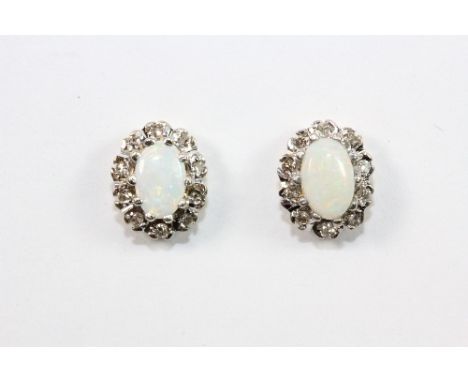 A pair of 9ct gold opal and diamond earrings