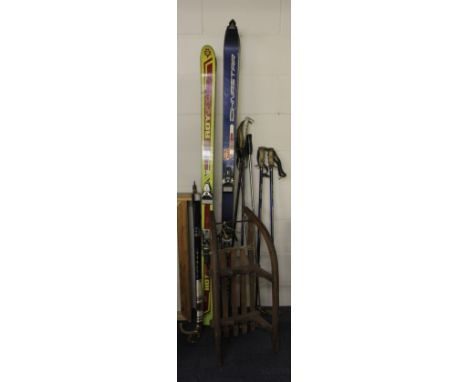 2 pairs of vintage ski's, ski poles and a vintage sled