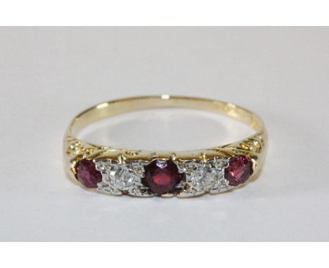An 18ct yellow gold ruby and diamond ring (N)