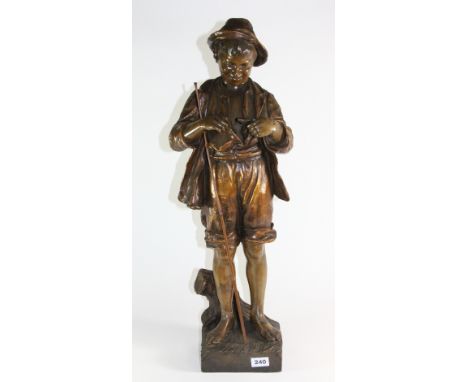 A large Goldscheider pottery figure of a boy with a fish, H 74cm (A/F)