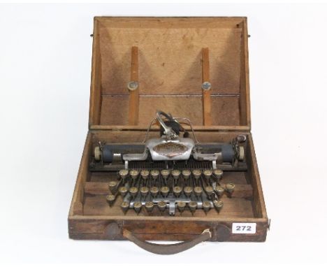 A cased early Blick featherweight portable typewriter