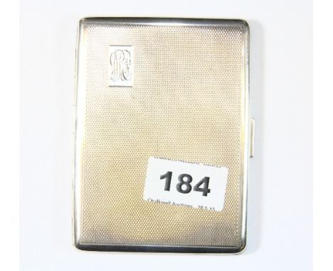 A hallmarked silver cigarette case with engine turned decoration