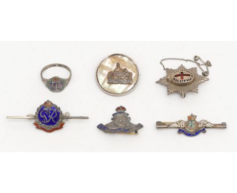 Six sterling silver military or sweetheart badges, to include, Coldstream guards, fleet arm, together with an ATS ring. (32g)