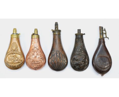 A leather powder flask with embossed hunting panel, a brass D. Xon &amp; Sons shell motif example, together with three copper