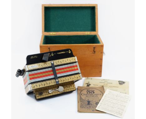 A Hohner ten button accordion, with floral detail, serial no. 16365, made in Germany, together with wooden travel case and va