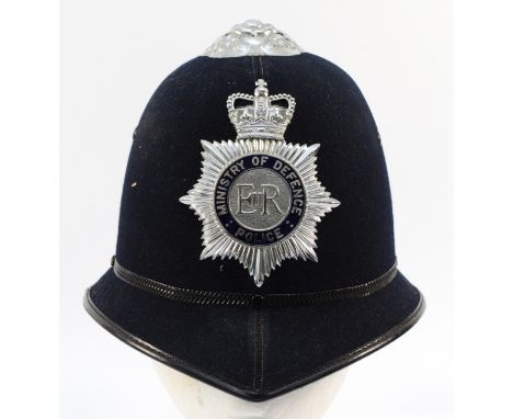 A ERII Cromwell Ministry Of Defence police helmet, stamped 55 and size 8 1/2.