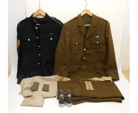 A staff Sergeant jacket, blue with Royal crowned buttons, chest 45cm, 75cm in length with the broad arrow stamped, with a Roy