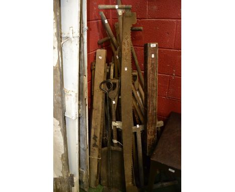Vintage agricultural tools including scythes; crosscut two handle saw; spades; slashers etc.