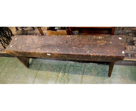 A rustic pitch pine bench.