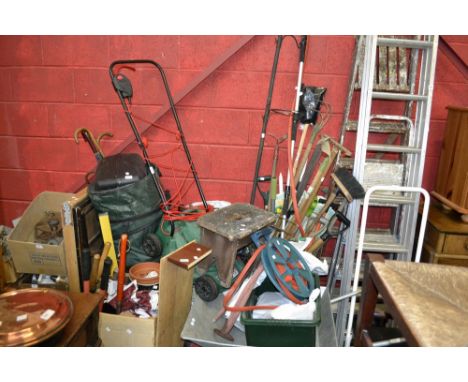 An extending aluminium ladder; wooden step ladder; another; wheel barrow; Qualcast Easi-Trac 320 electric mower; garden tools
