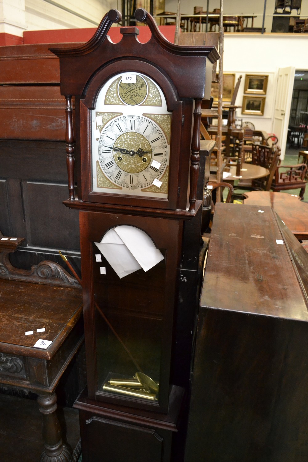 A reproduction Tempus Fugit Grandmother clock