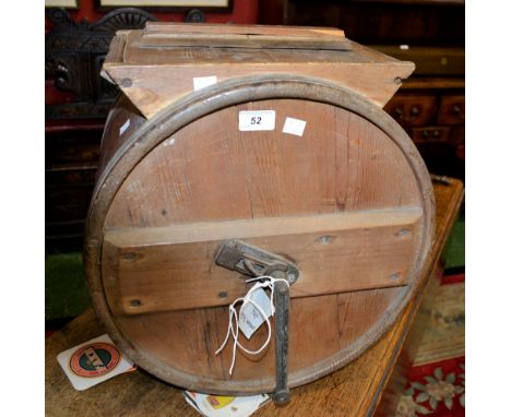 A vintage table top butter churn 