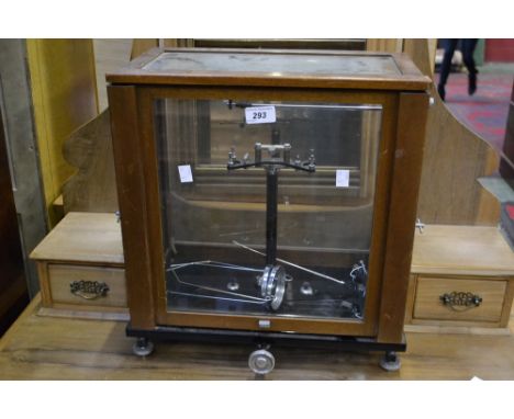 A set of scientific balance scales by Baird and Tatlock , cased 