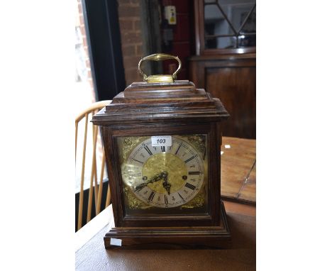 A striking mantel clock, three winding holes