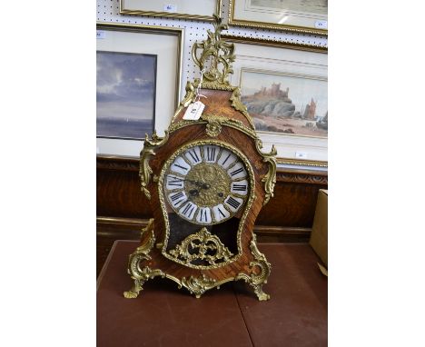 A French brass mounted marquetry mantel clock 