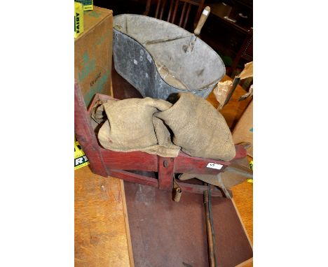 A vintage seed fiddle; a vintage galvanized seed spreaders bucket (2) 