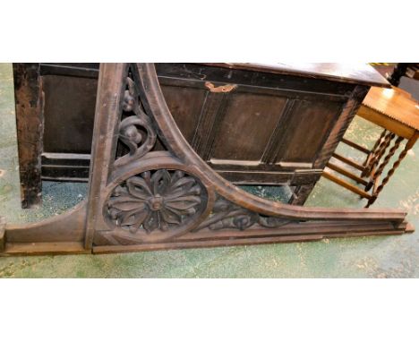 A carved oak hanging shop sign wall bracket.