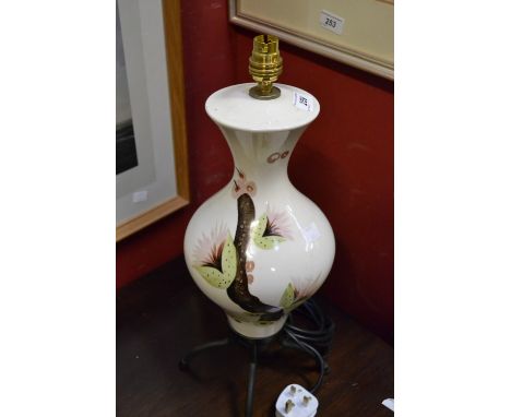 A 1950's table lamp,. stylised figures decoration