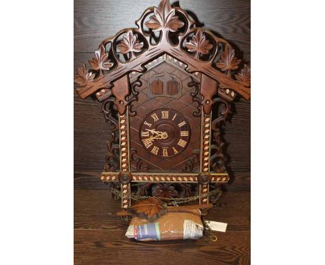 UNUSUAL GEOMETRIC MOTIF GERMAN DOUBLE WINDOW REGULA CUCKOO CLOCK
with an intricately carved foliate pediment over the double 