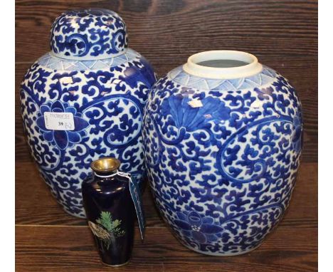 PAIR OF CHINESE BLUE AND WHITE GINGER JARS
with floral design, one with lid, both with double ring mark to base; together wit