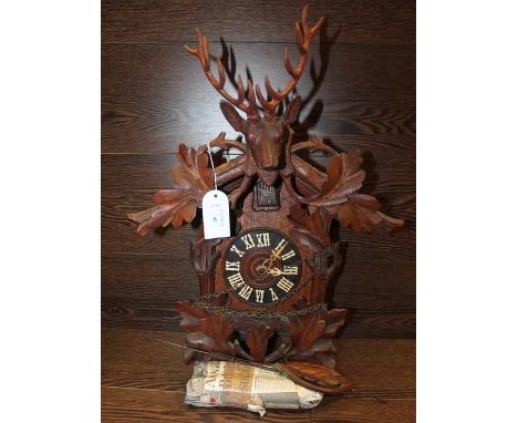 IMPRESSIVE GERMAN STAGS HEAD ONE DAY HUNTING CUCKOO CLOCK
with a carved mounted stags head pediment over the cuckoo window, b