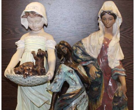 TWO TALL CERAMIC FIGURES OF GIRLS TOGETHER WITH A SMALLER EXAMPLE