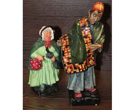 ROYAL DOULTON "THE CARPET SELLER" FIGURE HN1464
25cm high; together with another Doulton Figure "Sairey Gamp" 19cm high, both