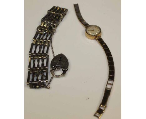 LADY'S NINE CARAT GOLD COCKTAIL WATCH WITH NINE CARAT BRACELET STRAP
together with a sterling silver gate link bracelet (2)