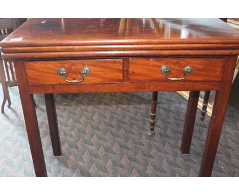 EARLY 19TH CENTURY MAHOGANY TEA TABLE/CARD TABLE
with two short drawers, over square legs, 75cm high, 81cm long
Scores and su