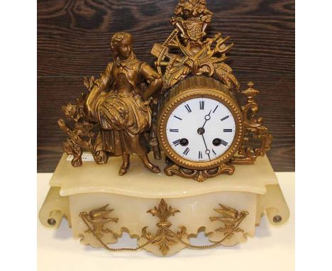 EARLY 20TH CENTURY FRENCH GILT BRASS ONYX MANTEL CLOCK
with enamel dial and figure, 30cm high, 31cm wide