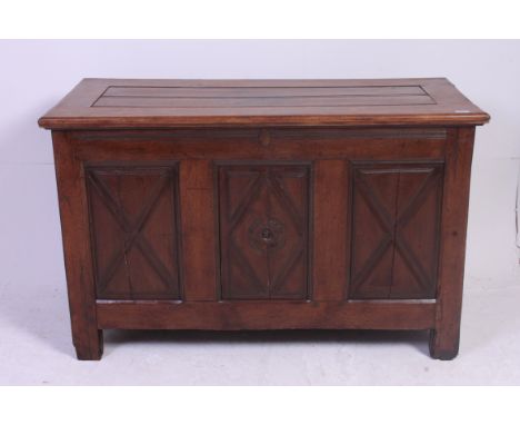A 19th century mahogany coffer - blanket box chest. Raised on stile supports having fielded panel body with hinged top above.