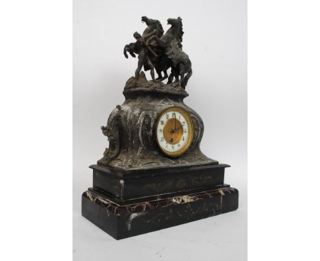 A good early 20th century spelter topped mantle clock, decorated with a wild horse figural group to the top, original brass m