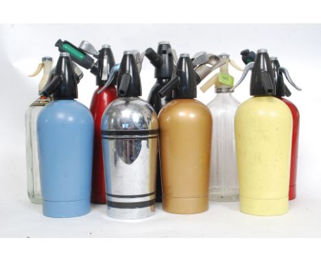 A collection ( nine ) of vintage and retro soda syphons, to include glass advertising examples and others please see images